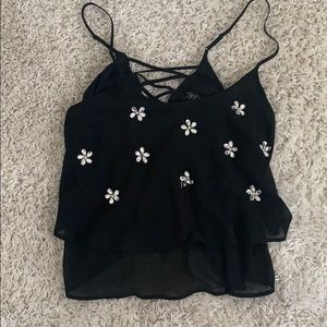 Black top I’m with flower gem embellishments